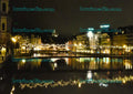 Luzern bei Nacht mit beleuchteter Seepromenade und Spiegelung im Wasser